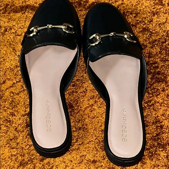 BCBGeneration Black Mules with Gold Buckles - Picture 2 of 6